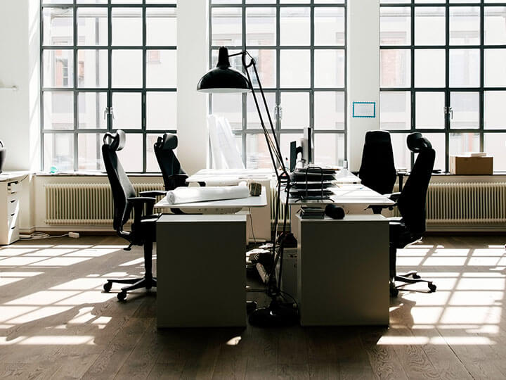 Office space with desks and chairs and computers