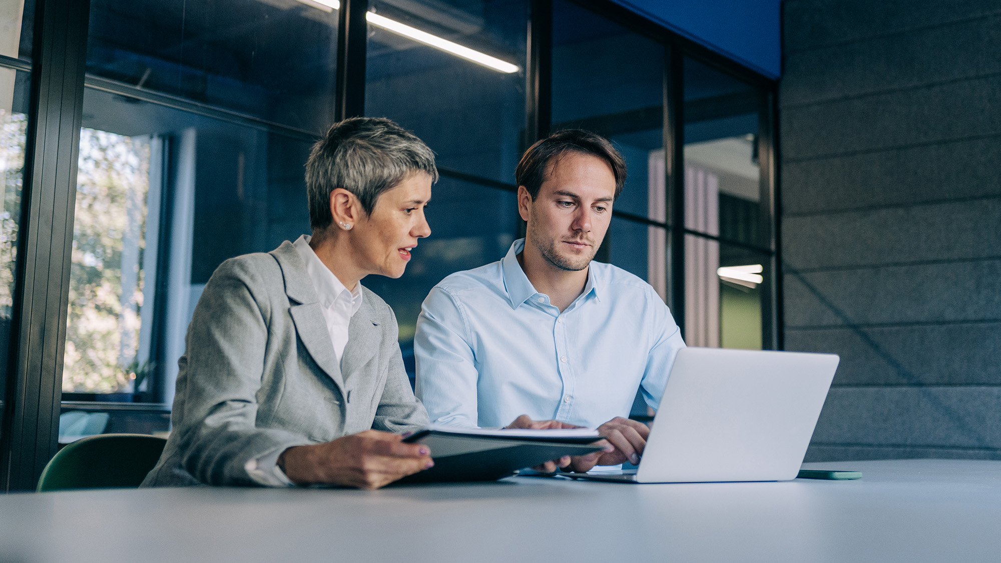 Colleagues discussing a project at work.